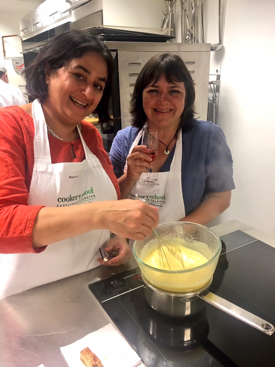 Roopa Gulati and Jenny Linford making citrus curd for the cupcakes.